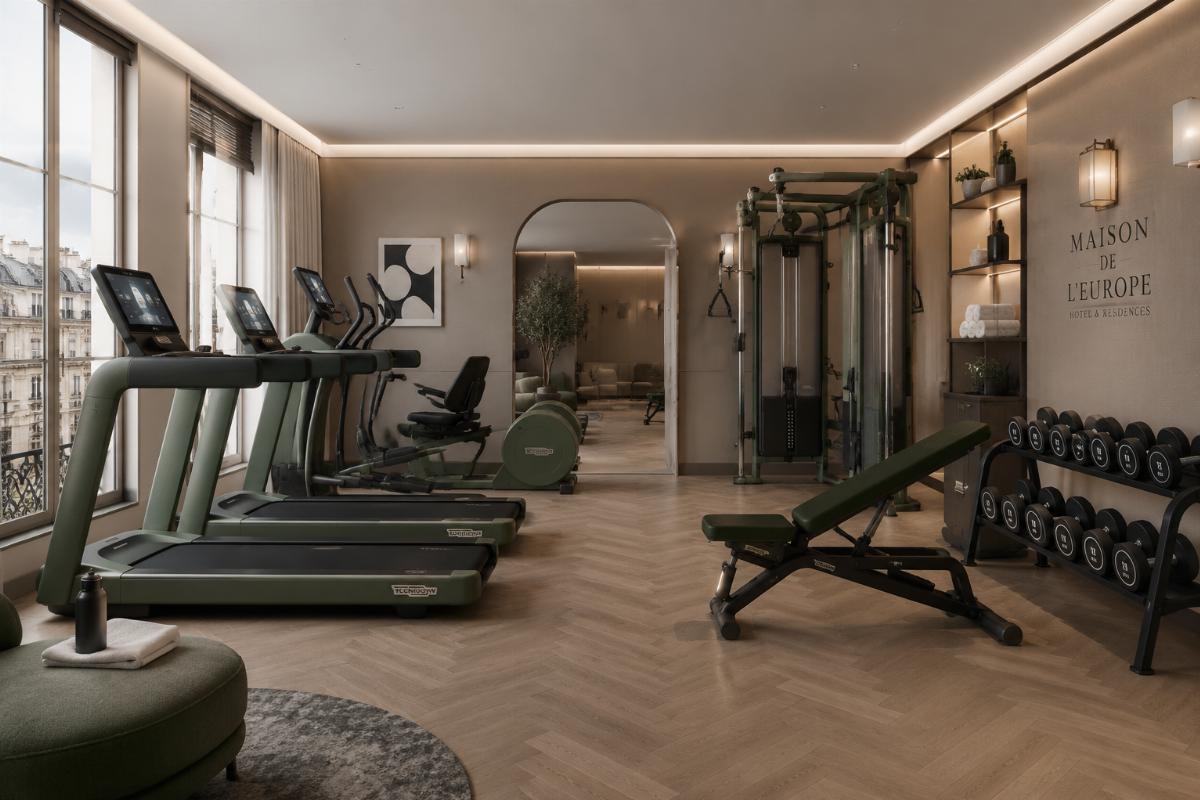 Custom colored hotel gym equipment matching a European apartment project’s interior design style