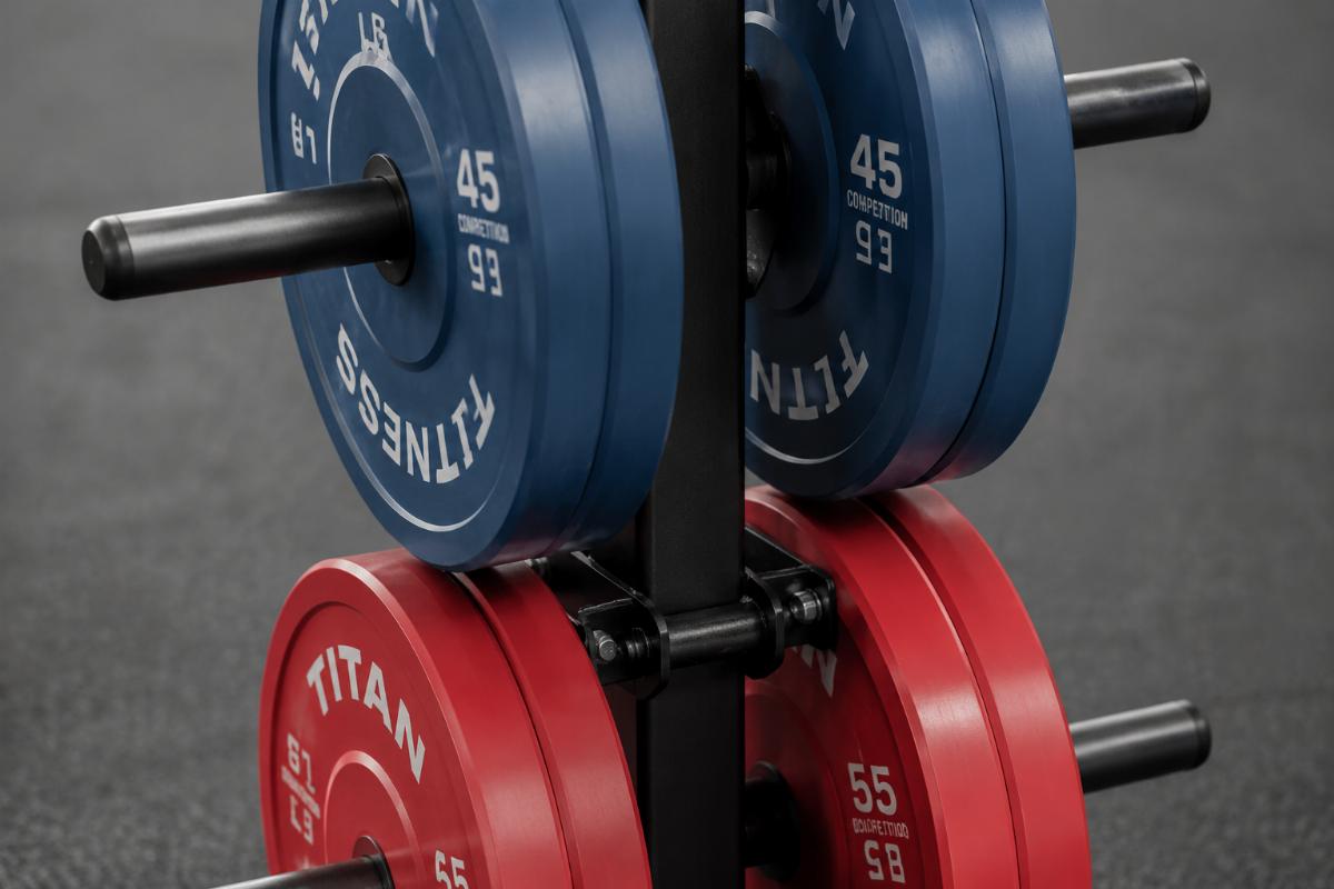 Close-up of plate storage tree peg configuration showing dual pegs per tier with competition bumper plates