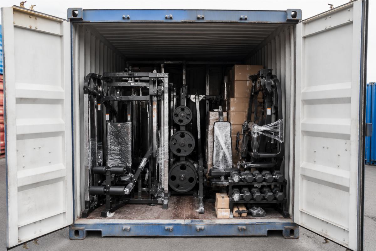Complete commercial gym equipment package loaded in shipping container