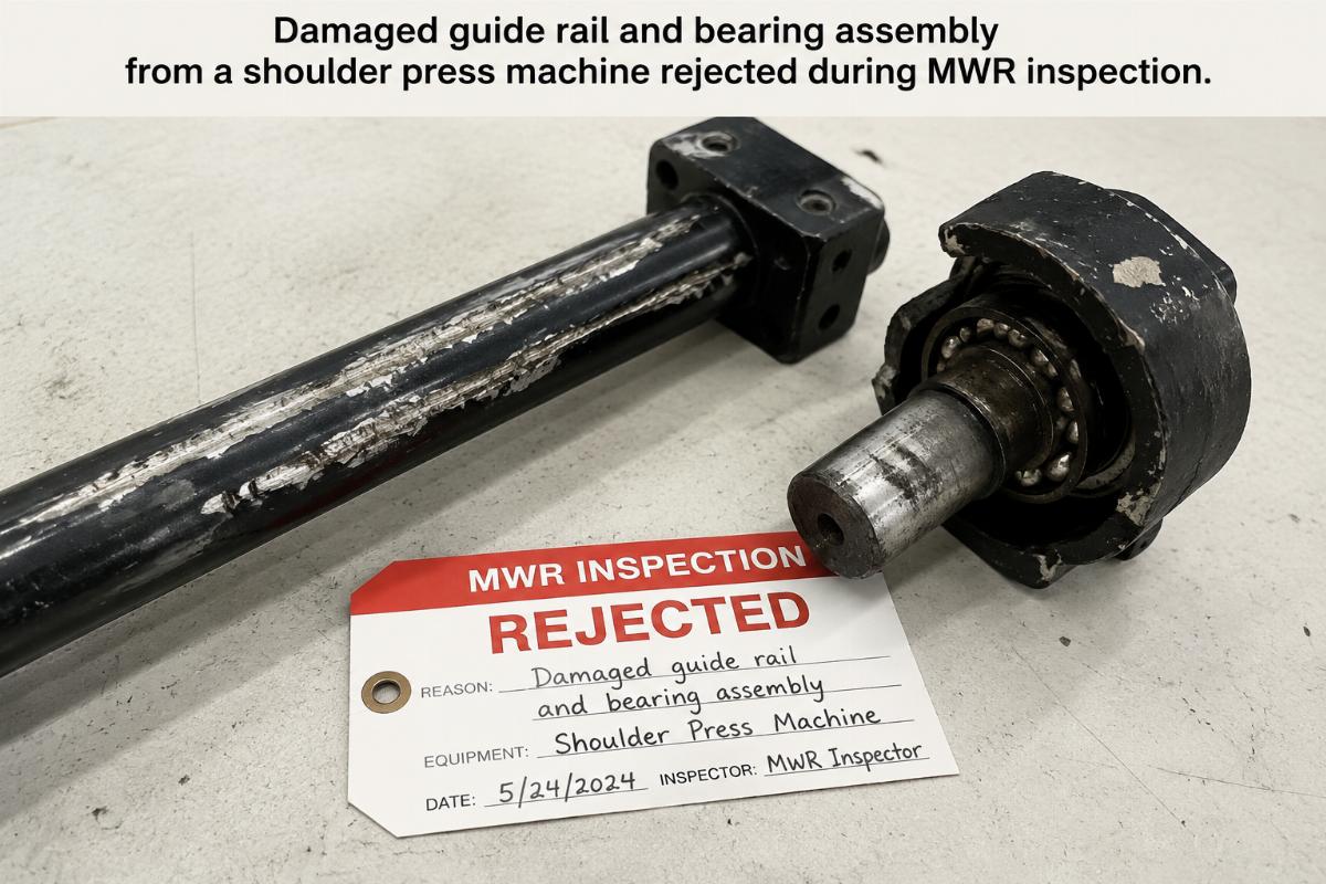 Damaged guide rail and bearing assembly from a shoulder press machine rejected during MWR inspection